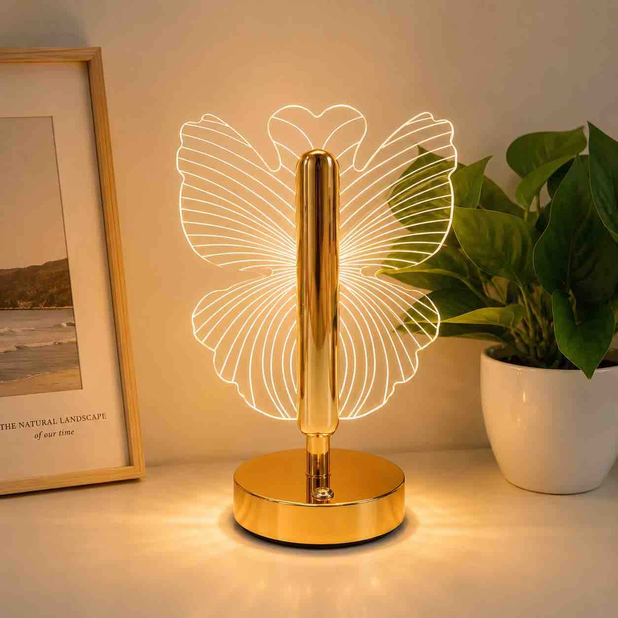 Dekorativna LED stolna lampa sa zlatnim postoljem i akrilnim motivom